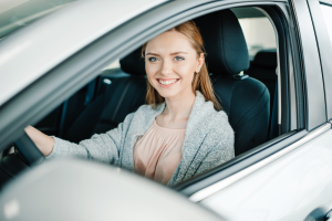 Girl Getting Ready to Drive a Car