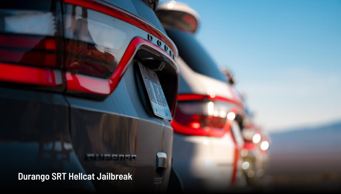 2026 Dodge Durango SRT Hellcat Jailbreak, rear close-up with multiple Durangos lined up under a clear sky.